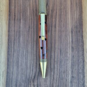 Stylo-bille castroverde, narra rouge (amboine), finition bronze patiné