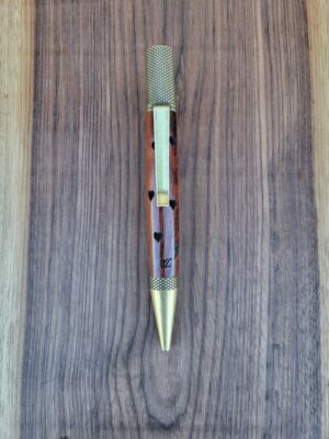 Stylo-bille Castroverde, narra rouge (amboine), finition bronze patiné